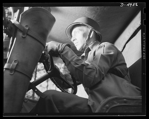 Fort Benning armored forces. Uncle Sam's drivers of the armored forces are the world's best. This man at the wheel of a halftrac car in the Fort Benning, Georgia training are knows how to tool through all kinds of tough going