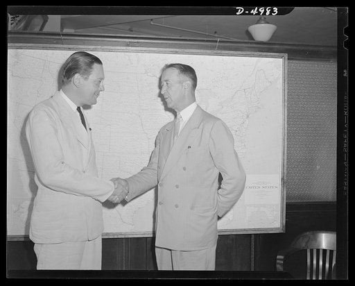 Paul Porter welcoming I. Chance Buchanan on new job. Buchanan was recently appointed head of the Alexandria-Arlington defense rental area