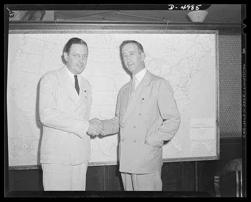 Paul Porter welcoming I. Chance Buchanan on new job. Buchanan was recently appointed head of the Alexandria-Arlington defense rental area