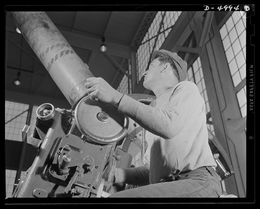 Production. Naval gun mounts. A naval gun mount assembly, one of many produced in a Midwest plant, is carefully inspected before shipment to an undisclosed destination. Westinghouse, Louisville