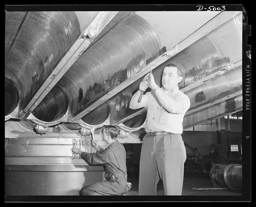 Production. Torpedo tube mounts. A torpedo tube mount in the final assembly stage at a Midwest machine shop engaged in volume production of mounts for torpedo tubes and large naval guns. Westinghouse, Louisville