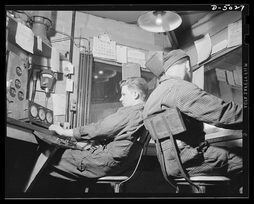 Production. Airplane engines. Airplane engine tests in a Midwest plant provide performance data recorded on an array of precision instruments in a small booth presided over by specially trained men. Continental Motors, Michigan