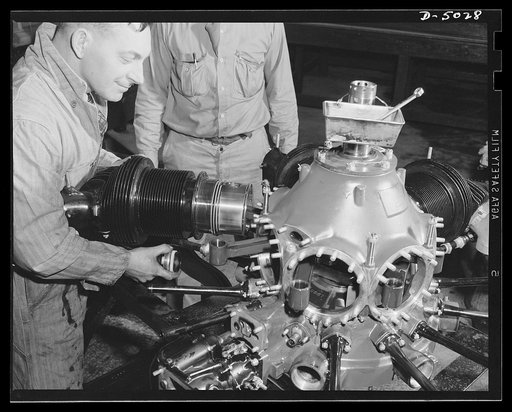 Production. Airplane engines. An airplane engine is torn down after it has gone through a grueling test in a Midwest plant. Each of the disassembled parts will be carefully inspected before the engine is reassembled and subjected to a final checkup. Continental Motors, Michigan