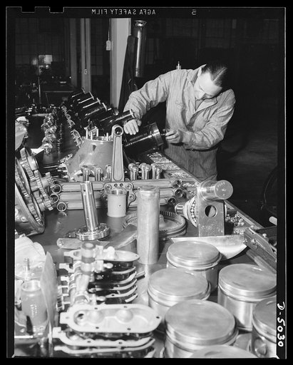 Production. Airplane engines. All the parts of an airplane engine, which has just undergone severe tests in a Midwest plant, are spread out for minute inspection. After the checkup, the engine will be reassembled and sent on for final inspection. Continental Motors, Michigan