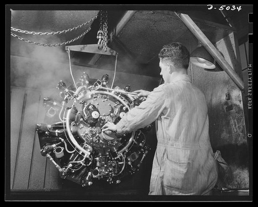 Production. Airplane engines. An airplane engine that has been assembled, tested, torn down, subjected to minute examination of all parts, and again assembled in a Midwest plant. It is now getting a bath before final inspection. Continental Motors, Michigan