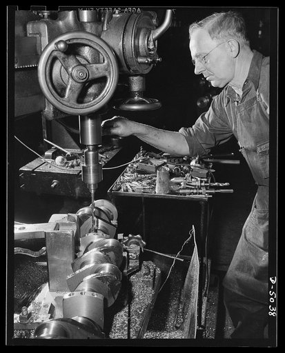 Production. Marine engines. A drilling operation on the crankshaft of a marine engine for the Navy. This workman in a Midwest plant can certify that every precaution is taken to assure the finest quality in every crankshaft produced. Continental Motors, Michigan