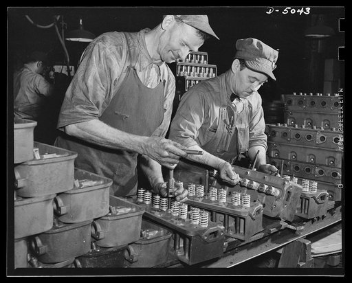 Production. Jeep engines. Assembling jeep engines in a Midwest plant. The hard-boiled little army cars rate the best of material and workmanship. Continental Motors, Michigan