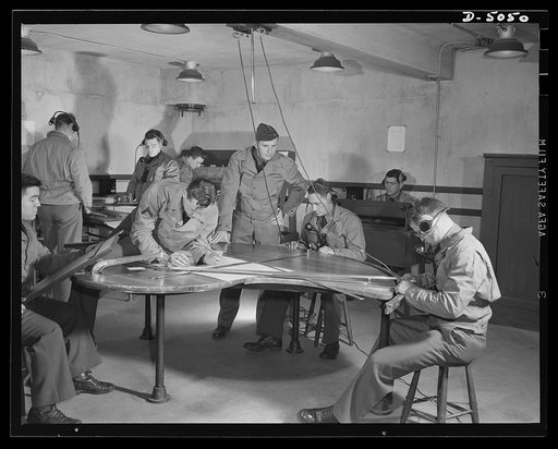 Fort Story. Coast artillery. In this coast artillery plotting room at Fort Story, Virginia, officers who direct the firing of the big guns work out the problems that are a part of gunnery