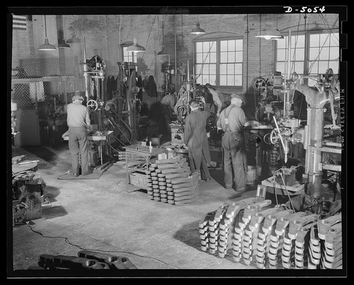 Subcontracting. Bogie-wheel assembly. Production of bogie-wheel assembly parts in the machine shop of an Eastern subcontractor. These machine operators are drilling, counterboring and milling bogie wheel levers. Painesville Machine Company