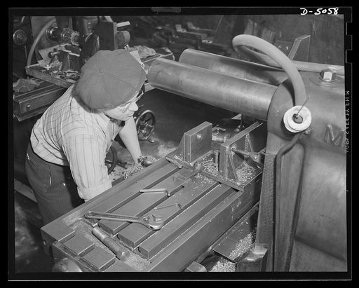 Subcontracting. Bogie-wheel assembly. A new jig is machined for use in the milling of a rubber plate in a bogie-wheel assembly. The work is being done in the machine shop of an Eastern subcontractor. Painesville Machine Company