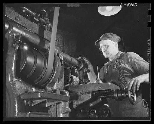 Subcontracting. Machine gun recoil plate. A slot is milled in a machine gun recoil plate, and the plate itself is cut to length in the machine shop of an Eastern subcontractor. Painesville Machine Company