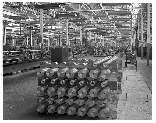 Conversion. Automobiles to 40 mm. anti-aircraft guns. Here, in a former automobile plant, 40 mm. anti-aircraft gun barrels are machined and made ready for front line duty. Since they must shoot fast moving objects at great distances, they must be finished to the very finest of tolerances. Chrysler C
