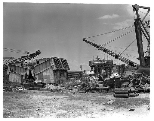 Industrial salvage. Marine iron and steel scrap. Iron and steel scrap, left over from the repair and replacement of marine boilers, turbine engines and other equipment, now ready for removal from the Seabrook, Louisiana yard of the Standard Dredging Corporation. Much of the old metal from heavy dred