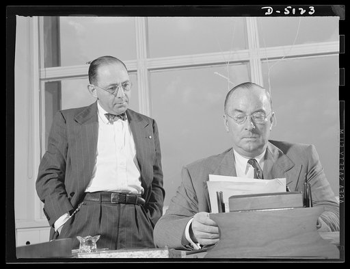 America's production chief. One of Donald Nelson's principal advisors in the War Production Board (WPB) is Sidney Weinberg, who also handles top personnel problems. At the moment, Mr. Nelson has a new program of work in mind and, characteristically, goes over the plan with the various staff members 