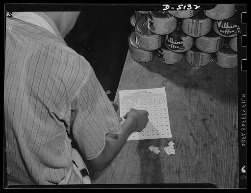 Sugar rationing. The coupons with which you and your neighbors purchase sugar are pasted onto a war ration stamp card by your grocer, who turns the filled card in to the Office of Price Administration (OPA) before his sugar stock can be replenished