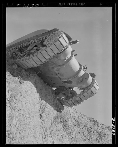 Testing M-4 tanks. A battleship of the land, one of America's mighty M-4 tanks, tops the ridge of a test hill as trial runs are made at an Eastern manufacturing plant