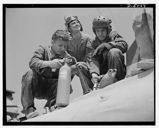One of Uncle Sam's new M-4 tanks is fueled for a training cruise at Fort Knox, Kentucky, where men of the armored forces are developed into hard-bitten "tankers"