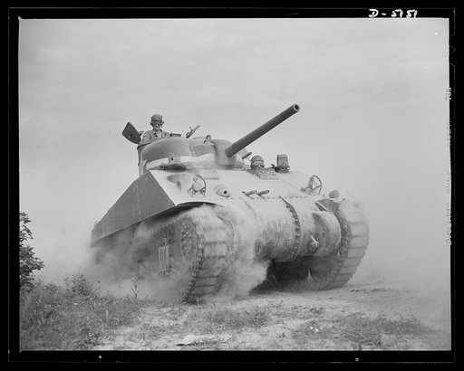 Fort Knox. M-4 tanks and crews. A hard-boiled "tanker" looks things over from one of the hatches of an M-4 tank. This man, with thousands of others, is brushing up on the latest tank-fighting technique at Fort Knox