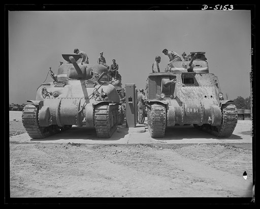 Fort Knox. M-4 tanks and crews. A new M-4 tank and a halftrac scout car practice coordination of activities in the school for the armored forces at Fort Knox, Kentucky. This M-4, with its strong welded hull and superior firepower, is welcomed by the "tankers" who man it as a notable addition to our 