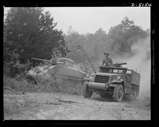 In the massive cast-steel hull of this M-4 tank, a crew of hard-bitten "tankers" is rehearsing a few fighting tricks at a training school of the armored forces at Fort Knox, Kentucky