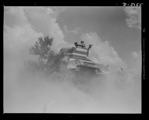 In the massive cast-steel hull of this M-4 tank, a crew of hard-bitten "tankers" is rehearsing a few fighting tricks at a training school of the armored forces at Fort Knox, Kentucky