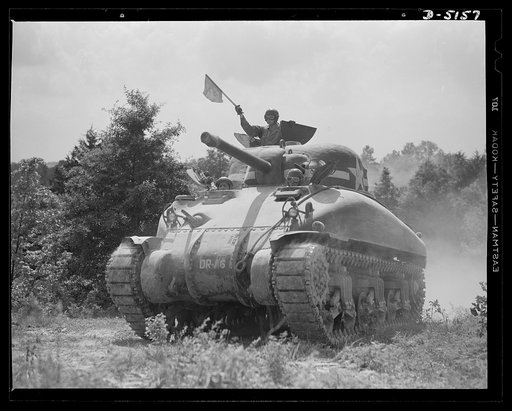 In the massive cast-steel hull of this M-4 tank, a crew of hard-bitten "tankers" is rehearsing a few fighting tricks at a training school of the armored forces at Fort Knox, Kentucky