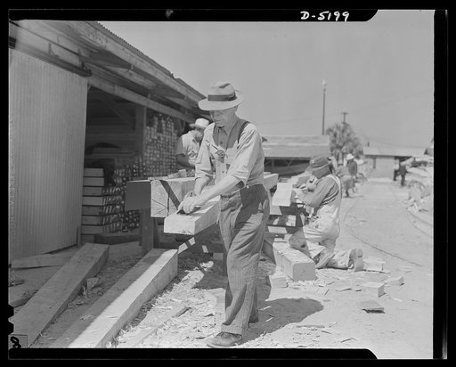 Production. Minesweepers. Planing down a keel section for one of Uncle Sam's new minesweepers. The experience which this carpenter gained in house construction comes in handy in the shipyard where he is now employed. Gibbs Cass Company