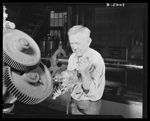 Production. Minesweepers. He's still being strong at seventy-two. George Cardy gave up what he considered a soft job, watchman on a yacht, to take up his old work of servicing marine engines in an Eastern shipyard now turning out minesweepers. "One is as young as he feels," says Mr. Cardy, who is a 