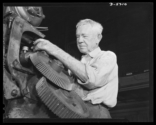Production. Minesweepers. He's still being strong at seventy-two. George Cardy gave up what he considered a soft job, watchman on a yacht, to take up his old work of servicing marine engines in an Eastern shipyard now turning out minesweepers. "One is as young as he feels," says Mr. Cardy, who is a 