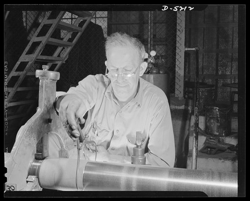 Production. Minesweepers. A veteran of the last world war operates a lathe that turns out tail shafts for minesweepers under construction in an Eastern shipyard. Gibbs Cass Company