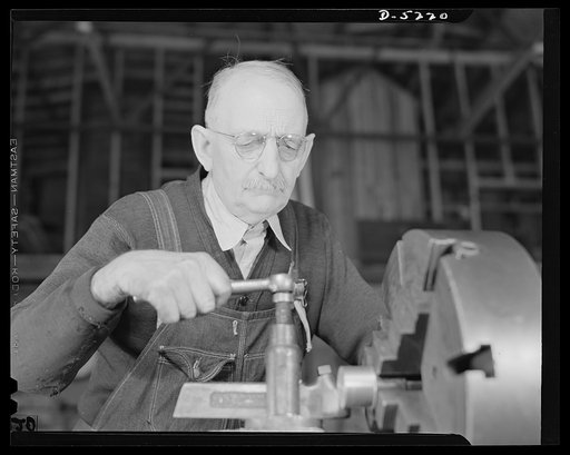 De Land pool. Carr's Machine Shop. Nothing makes W.E. Mansfield so mad as the idea that Florida shops cannot do fine precision work. He should know, for he's doing it in a member shop of the De Land pool. He worked on weapons and ammunition for the Winchester Arms Company for twenty years and though