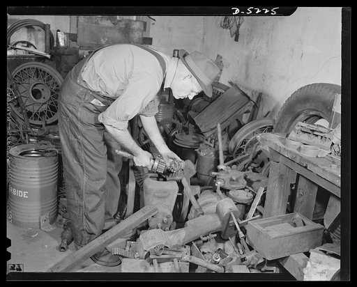 De Land pool. Bits and parts. Old pumps, gears, chains, parts from every kind of machine under the sun comprise Casey's source of supply in the corner of his De Land, Florida shop. When he needs a new machine, most of the parts come from this junk heap. On a recent contract handled by the De Land po