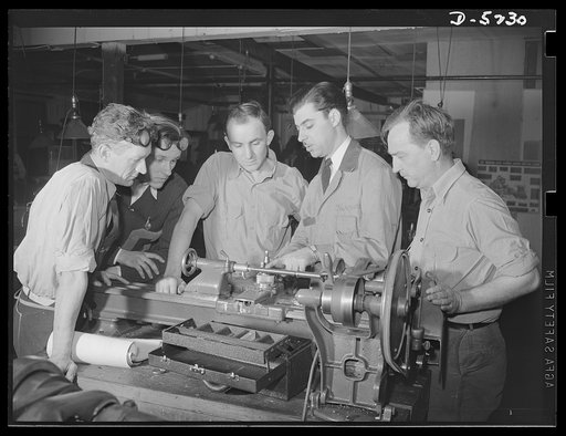 Subcontracting. Passaic home workshop pool. Lathe parts are explained to students in the trade school of the Howe Machinery Company, Passaic, New Jersey. The school trains fifty workers at a time in the production of essential war equipment. More than ninety percent secure jobs after training, some 