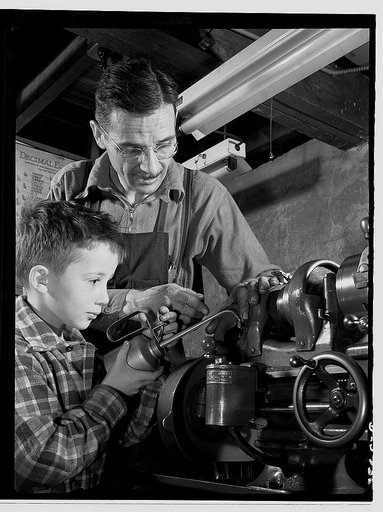 Subcontracting. Passaic home workshop pool. George Carell's seven-year-old son likes to watch his father produce essential war equipment in his Paissaic, New Jersey home workshop. Mr. Carell belongs to a subcontract pool organized by the Howe Machinery Company of his city