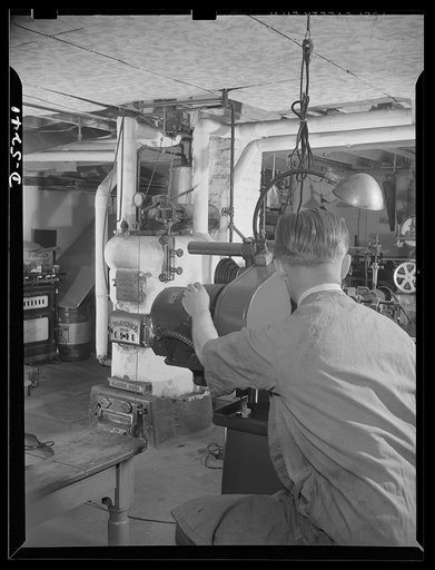 Subcontracting. Passaic home workshop pool. In the basement workshop of the Passaic, New Jersey home of Jack Vida, who employs four men to turn out essential war equipment as a member of a subcontracting pool organized by the Howe Machinery Company of Passaic