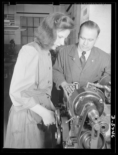 Subcontracting. Passaic home workshop pool. Stella Wolos, who was a sewing machine operator, is grinding a drawing angle on a cartridge die in the Passaic, New Jersey shop of the Howe Machinery Company. This concern is training a number of young women for war production jobs