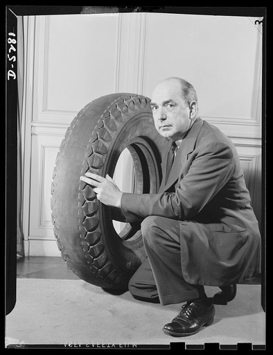 Conservation. Truck tires run 146,000 miles. No. 1. John L. Rogers, Director of the Division of Motor Transport, Office of Defense Transportation, displays a still-usable truck tire which has run 146,000 miles. The air pressure in its present condition