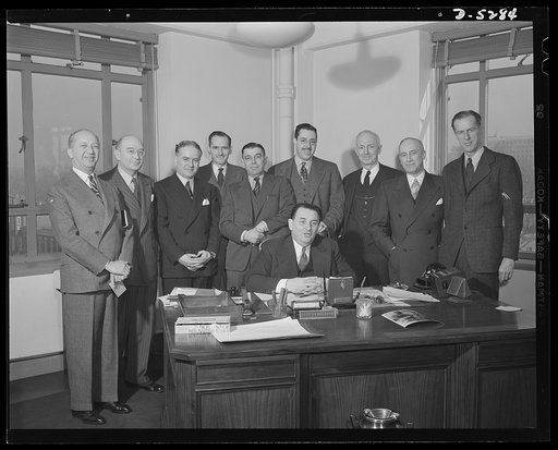 Office of Price Administration Regional Administrators with Mr. Henderson. Regional Administrators of the Office of Price Administration with Leon Henderson (seated), OPA Administrator, just prior to his retirement from office. Shown standing are, left to right: Harry F. Camp, San Francisco; John C.