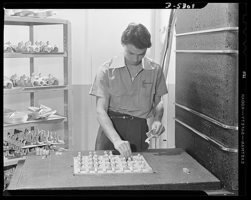 Production. Aircraft. Setting up aluminum castings for X-ray in a large Western aircraft plant. Each one is numbered and, unless the X-ray film shows it's flawless, the part will go to the salvage scrap heap