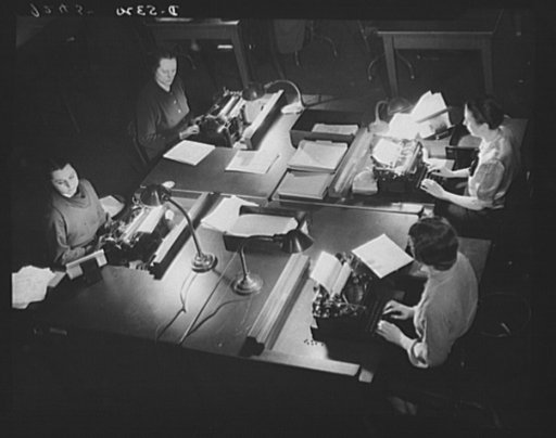 Young women on the nation's myriad filing lines, plow their efficient way through the miles of additional clerical work which the war has brought to government agencies in Washington and throughout the United States of America