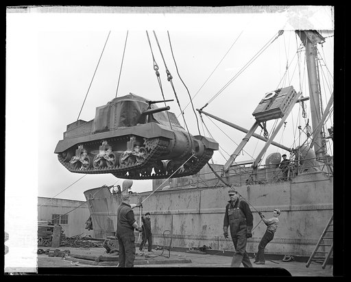 Lend-lease in action. American M-3 tanks, "General Grants," are in action in Africa and are preparing for battle in Australia. The picture shows an M-3 tank, lend-leased to the United Nations, being hoisted aboard a cargo vessel at an unnamed American port