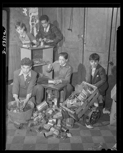 Boys organize tin club. Salvaging more than 500 pounds of tin cans in one day, these Harlem youngsters organize a Tin Can Club of America, under the auspices of the New York City Salvage Committee. At their headquarters in a vacant store at 151 East 103rd Street, these patriotic young men not only c