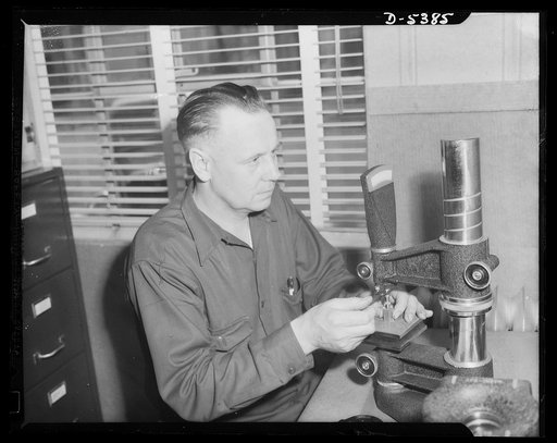 Harvest for Hitler. Ed Sundholm, a veteran of World War I, at work in the war plant which he transformed from a peaceful dairy farm into an arsenal of victory for the United Nations. The cows won't come home, says Mr. Sundholm, until this two-hundred fifteen thousand dollar near Albert City, Iowa no