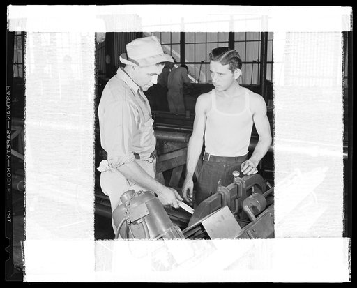 Production. Subchasers. The foreman of the machine shop of a Southern shipyard gives some pointers on the operation of an electric power-cutter to a machinist helper. This foreman is one of the men who made it possible for the yard to fly the Navy "E" for its excellent performance on the building of