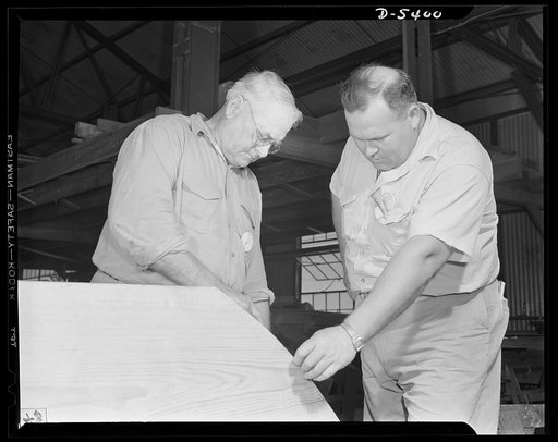 Production. Subchasers. An old shipwright and a son who came up in the same trade inspect a timber that will be used in the keel of a new subchaser. The father had retired some years ago, but came back to give his skill and experience to an Eastern shipyard. He is now foreman of the keel department 