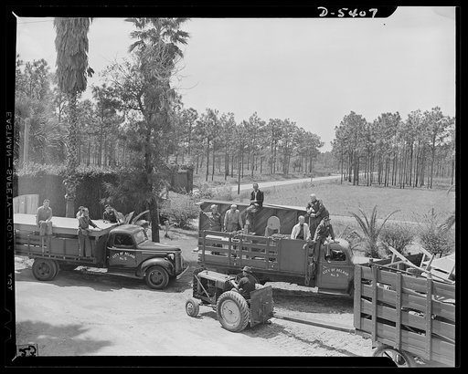 De Land pool. Moving circus. A circus moved out of its winter quarters in the Volusia County, Florida fairgrounds to make way for a defense plant when the De Land industrial pool got under way. Fairgrounds' buildings were the only ones in the community big enough to handle the needed assembly line. 