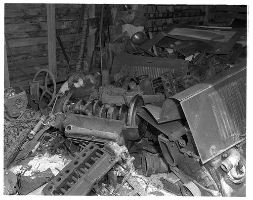 De Land pool. La Roe shop. The La Roe "stock" room at Eustis, Florida. When the La Roes needed high-speed steel for dies and tools in tooling up their little garage workshop, they just walked over to this heap, picked out the right metal and made what they needed on the spot
