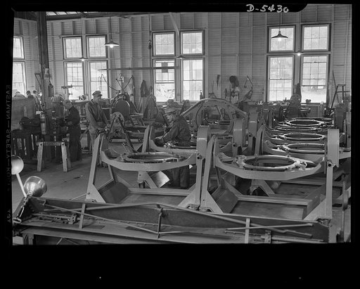 De Land pool. Babcock airplane plant. Interior of the Babcock plant at De Land, Florida. When the Japanese struck Pearl Harbor, this was a dormant airplane plant. It was revived as a community project. Businessmen of De Land pooled their machines and resources, used this plant as a prime contractor 