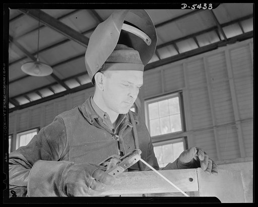 De Land pool. Babcock airplane plant. Joe Wheeler Miller of De Land, Florida is doing his part in making machinery that will keep American fighting planes in the air. He was named after a southern general, Joe Wheeler, by a father who thought the General was "the fightinest man he knew" and wanted h