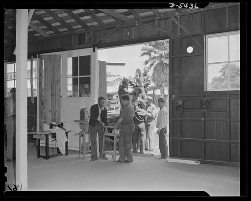 De Land pool. Skilled craftsmen. The De Land, Florida pool didn't have a shop big enough to fulfill a two-million-dollar contract for gliders. So it took over the county fairgrounds, formerly winter quarters for a circus, and built an assembly line through its seventeen roomy buildings. The pool's f